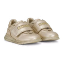 gold low-top sneakers