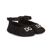 black lace ballerinas with ankle straps and a rhinestone dg logo